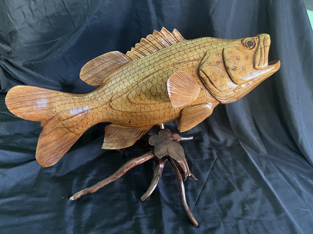 Highly Detailed Grouper or Bass Fish Wood Carving On Wood Driftwood